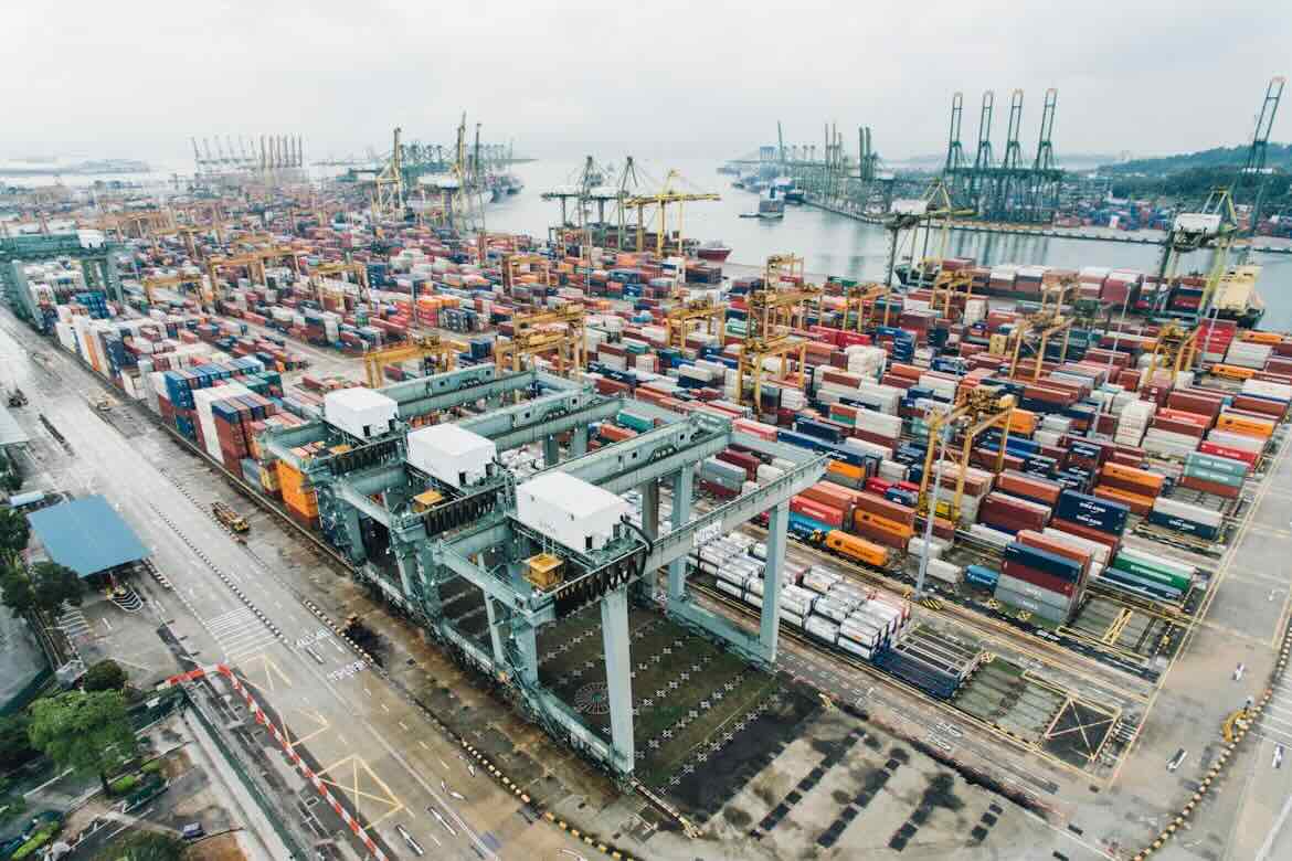 A wide shot of a shipment container yard